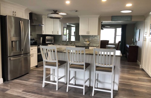 Port Richey Haus | 2/2 Canal Front w/10,000 covered boat lift and floating dock.