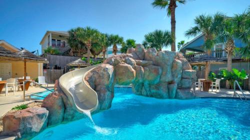 Port Aransas Haus | 2 Blocks to the Beach Patio Resort Pool w Slide Tranquil Tides by AvantStay