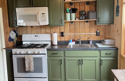 East Tawas Haus | 5 minutes from Downtown East Tawas, On The Rocks is a cottage on Lake Huron