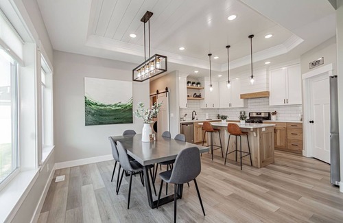 Idaho Falls Haus | 6 bed 3 bath home ~ sleeps 20! w/ game room, fireplace, hot tub & playground.