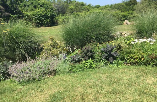 New Shoreham Haus | A Block Island landmark with historic charm, gardens, long water views