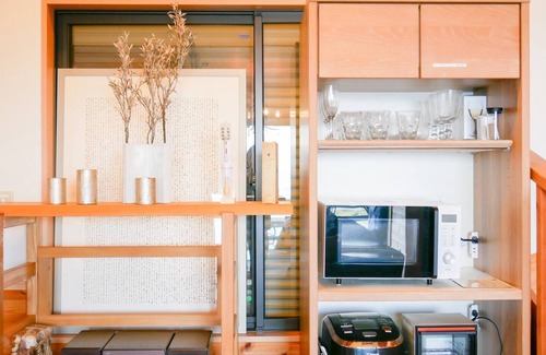 Shimotaga Haus | A spectacular view! Relax on the sea-view terrace / Scandinavian log house with hot spring & fireplace