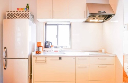 Shimotaga Haus | A spectacular view! Relax on the sea-view terrace / Scandinavian log house with hot spring & fireplace