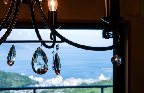 Shimotaga Haus | A spectacular view! Relax on the sea-view terrace / Scandinavian log house with hot spring & fireplace