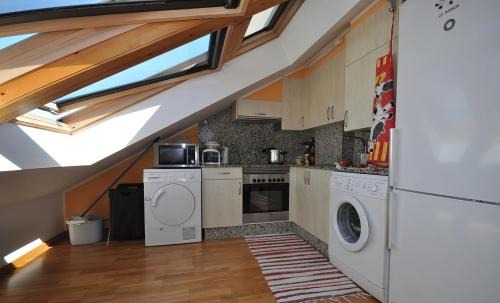 O Pindo Wohnung | Acogedor ático a pie de mar y montaña.