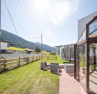 Davos Wohnung | Agrimonia - 5,5-Zi Duplex Wohnung bis 11 Personen mit eigenem Garten