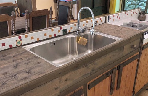 Matsusaka Haus | An old house with a spacious kitchen surrounded by mountains and clear streams