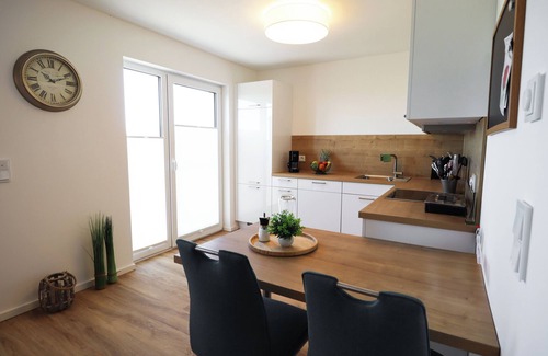Tossens Wohnung | Ankerhuus - enjoy nature on the dyke. Sauna. Fireplace. Terrace.