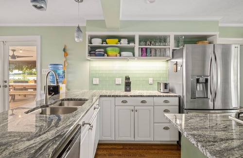 Reedville Haus | Bayfront Oasis with Heated Pool, Hot Tub & Playground! Family & Pet friendly!