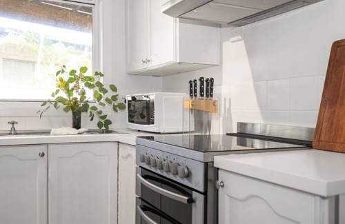 Emerald Beach Haus | Beach Cockatoo, Sleeps 4, start your day with a surf or walk on the beach