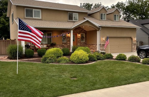 River Bottoms Haus | Beachy Home in Provo. Large deck with builtin hot tub, Fire pit, Palapa
