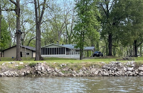 Wright Haus | Cabin sits in the back of a wild pecan grove over looking the Arkansas River