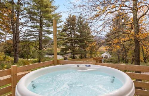 Johnson Haus | Caboose Tiny Home on river with hot tub near Stowe
