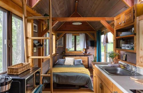 Johnson Haus | Caboose Tiny Home on river with hot tub near Stowe