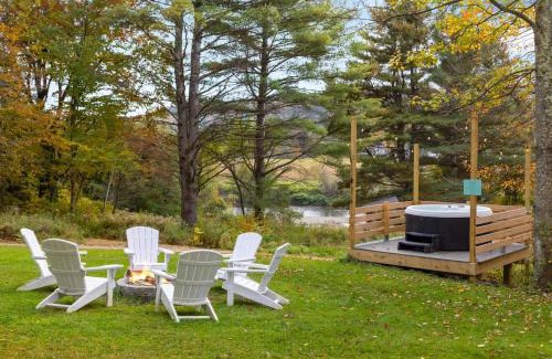 Johnson Haus | Caboose Tiny Home on river with hot tub near Stowe