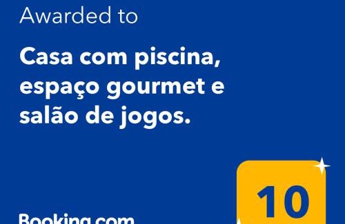 Caneca Fina Haus | Casa com piscina, espaço gourmet e salão de jogos.