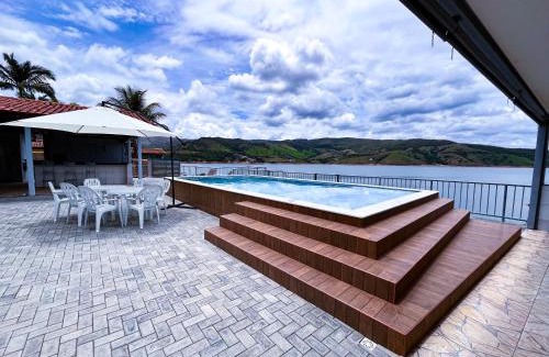 Capitolio Haus | Casa em Capitólio com piscina e vista para lago | W1