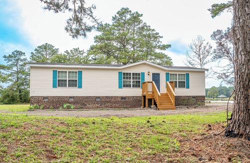 Belhaven Haus | Charming 3-bedroom house on the water with a dock, close to Belhaven & Bath NC.