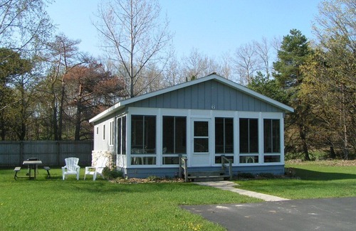 Northport Haus | Charming cottage with shared beachfront on Grand Traverse Bay near Northport.