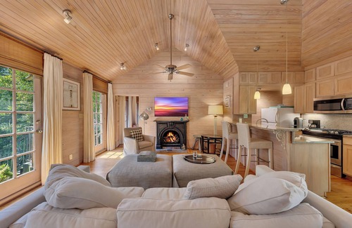 Buckhead Haus | Charming garden guest house tucked behind a gated driveway in Buckhead. King bed, full kitchen, washer/dryer, smart TVs, and private outdoor space.