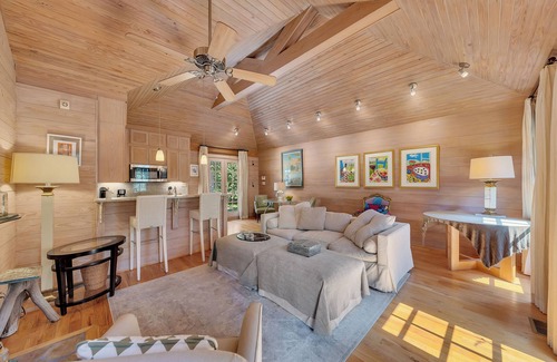 Buckhead Haus | Charming garden guest house tucked behind a gated driveway in Buckhead. King bed, full kitchen, washer/dryer, smart TVs, and private outdoor space.