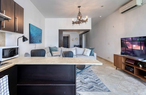 Libertad Wohnung | Charming & sunlit condo with pool & balcony - near golf, beaches, & nightlife