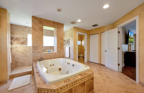Parkland Haus | City Oasis is a Gorgeous Home with a Pond, Pool table, Poker, and Heated Pool!