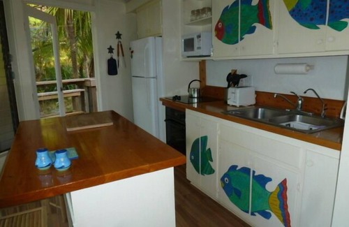 Green Turtle Cay Hütte | Coco Nut Tree House liegt in tropisches Laub auf das kristallklare Meer von Abaco gelegen