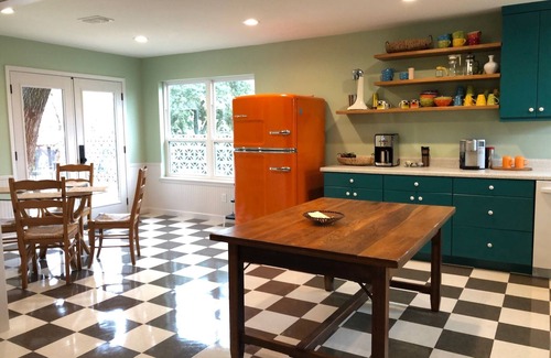 Ingram Haus | Colorful waterfront retro compound, airstream kitchen, hot tub, media barn!