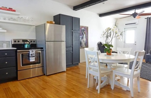 Talent Wohnung | Cottage 1 offers a king-sized bed, dining area, full kitchen, hot tub.