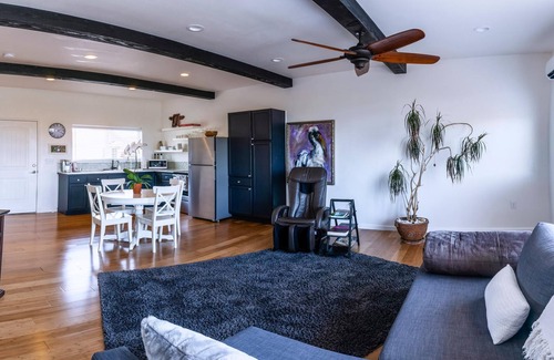 Talent Wohnung | Cottage 1 offers a king-sized bed, dining area, full kitchen, hot tub.