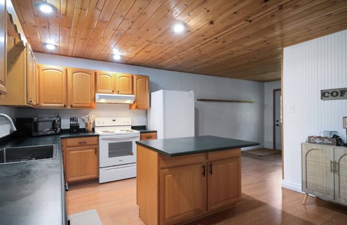 Paris Haus | Crystal Rapids Retreat: Cozy Up to Autumn's Beauty on the Muskegon River.