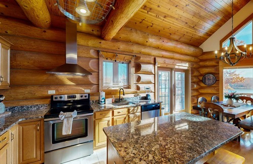 Mineral Haus | Custom lakefront home with lake views, hot tub, firepit, fireplace, dock, & deck