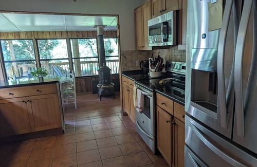 Picayune Haus | Delightful 4-BR with pond, deck, spacious yards in Picayune