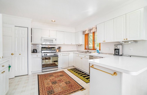 Arcadia Haus | Dog-friendly, lake view home with three season room, fireplace, video projector