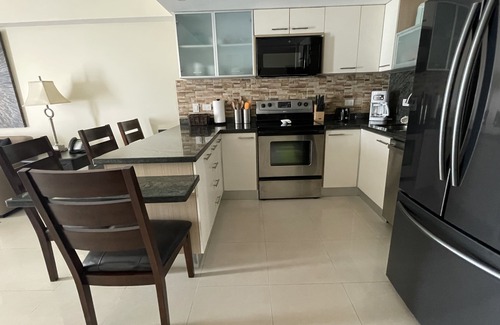 Oranjestad-West Eigentumswohnung | Penthouse Condo mit privater Dachterrasse in Ozeanien am Eagle Beach