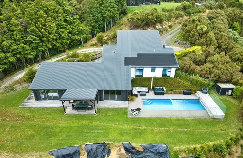 Mangawhai Haus | Exclusive home with uninterrupted views of the Hen & Chicks, set in Native Bush