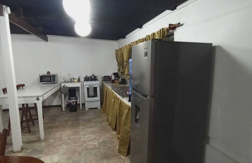San Ignacio Wohnung | Experience comfort and relaxation in our air-conditioned apartment, featuring two spacious bedrooms, a welcoming living room, a fully equipped private kitchen, and a well-appointed private bathroom. Perfect for families or groups.
