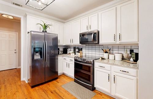 East Point Haus | Exquisite home with charming deck, washer/dryer, & central AC