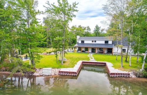 Alanson Haus | Fire Pit and Lake Views Cozy Crooked River Retreat!