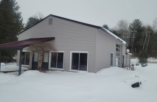 Mancelona Haus | Four Season Wonderland in Bellaire - close to Torch Lake, golf, skiing