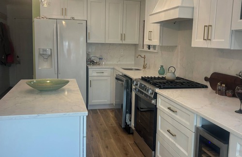 Mystic Island Haus | Fully upgraded home with gourmet kitchen waterfront outdoor oasis lanai,