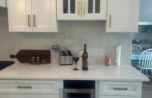 Mystic Island Haus | Fully upgraded home with gourmet kitchen waterfront outdoor oasis lanai,