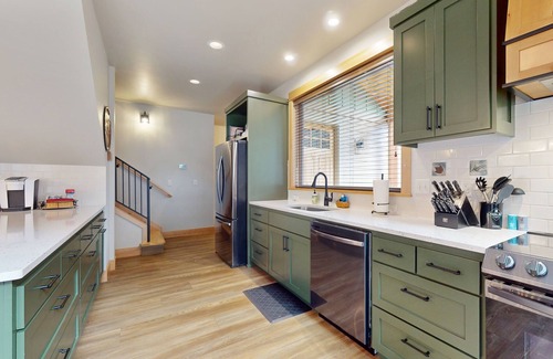 Vida Haus | Fully rebuilt riverfront home with deck, fireplace, & W/D - dog-friendly