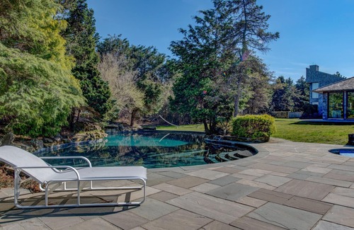 Sagaponack Haus | Glam-style home with private pool, open-floor plan, floor-to-ceiling.