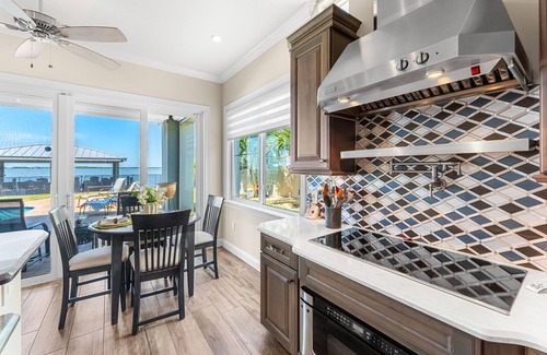 Cocoa Isles Country Club Haus | Gorgeous Direct Riverfront Pool Home W/ Private Balcony, Movie Room, & Fire Pit!