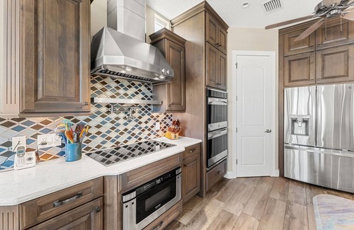 Cocoa Isles Country Club Haus | Gorgeous Direct Riverfront Pool Home W/ Private Balcony, Movie Room, & Fire Pit!