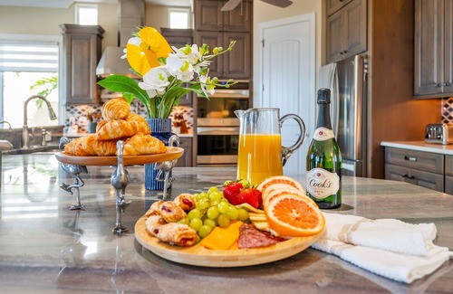 Cocoa Isles Country Club Haus | Gorgeous Direct Riverfront Pool Home W/ Private Balcony, Movie Room, & Fire Pit!