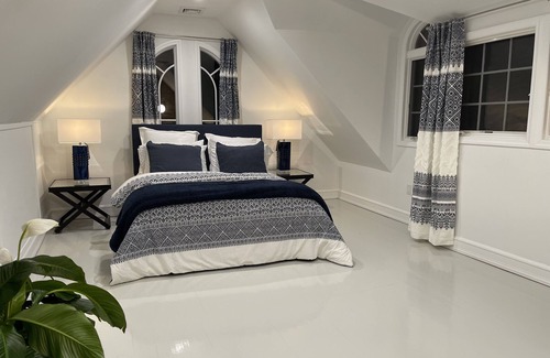 North Bellport Haus | Guesthouse duplex apartment with gorgeous pool & gardens!