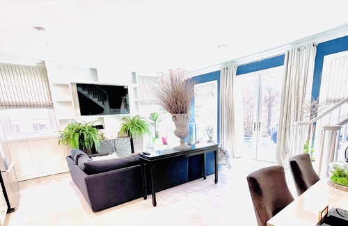 North Bellport Haus | Guesthouse duplex apartment with gorgeous pool & gardens!